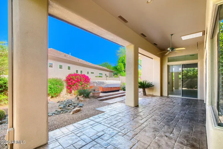 Covered patio, beautiful folage and a Lemon Tree
