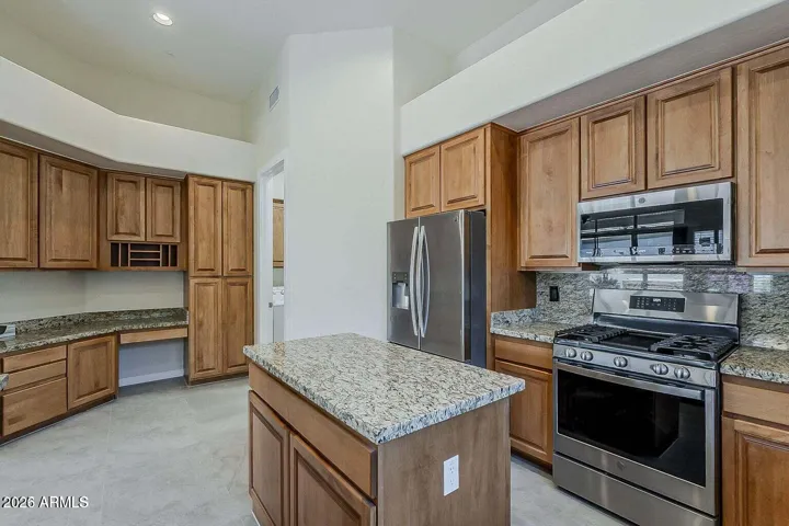 Slab granite Countertops, Stainless Steel Appliances, Additional desk space