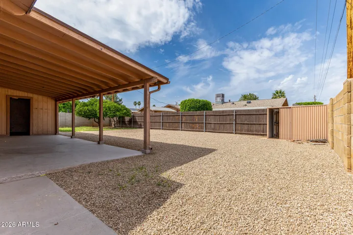 Door to the back of the covered patio is the large laundry room.