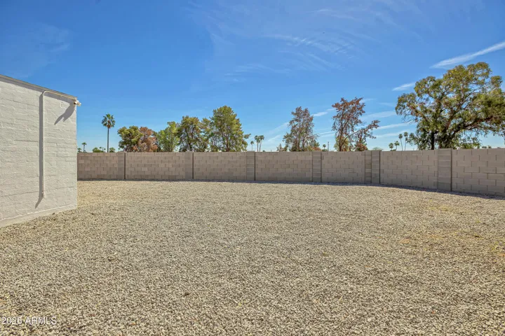 Expanisve side and backyard has side access to front drive