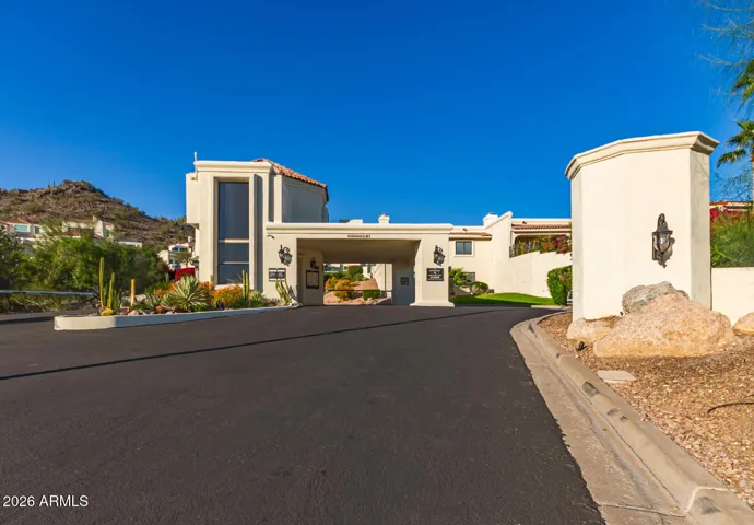 The guard-gated entrance to Estate Antigua from Lincoln Drive.