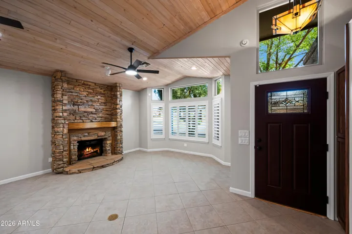 Wood burning, stacked stone fireplace