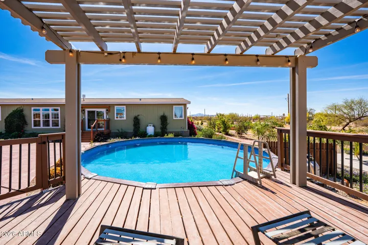 Pool with pergola covered deck
