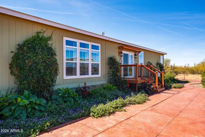Backside of Home with colored concrete walkway