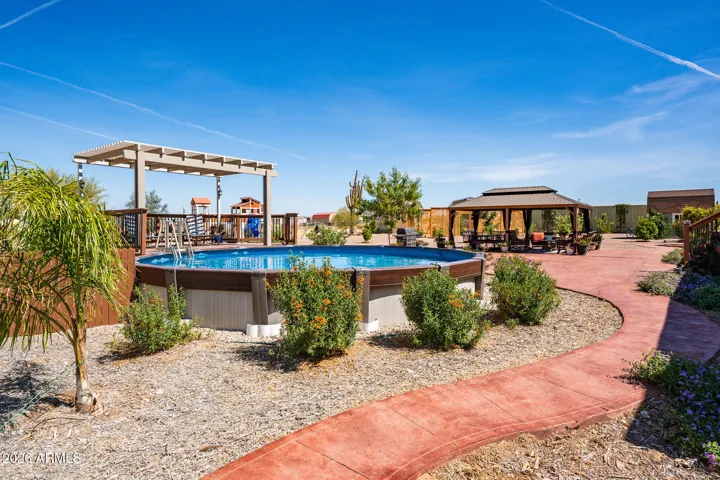 Pool with pergola covered deck