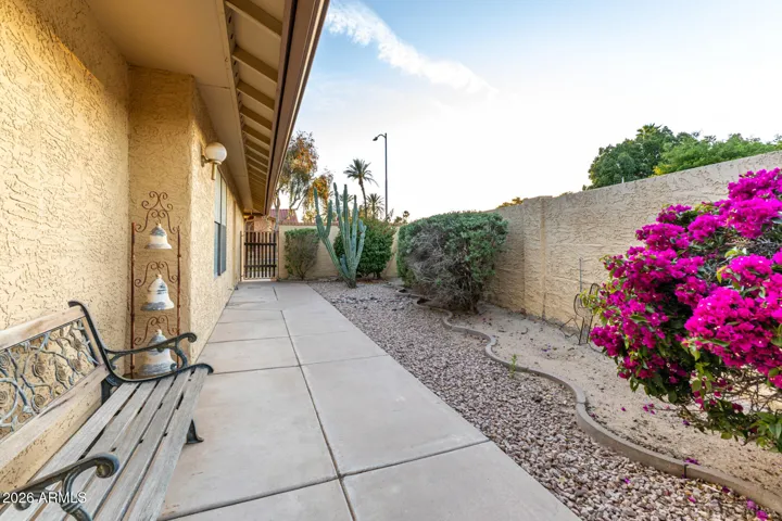 Side walkway (looking towards entrance gate, front door on the left)