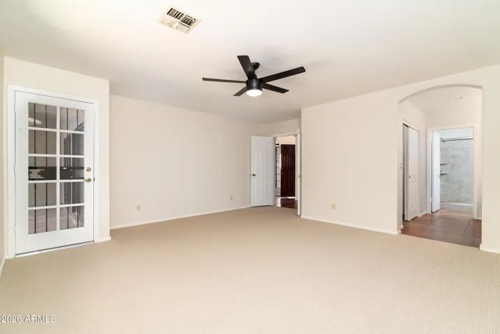 Primary bedroom with door to AZ room