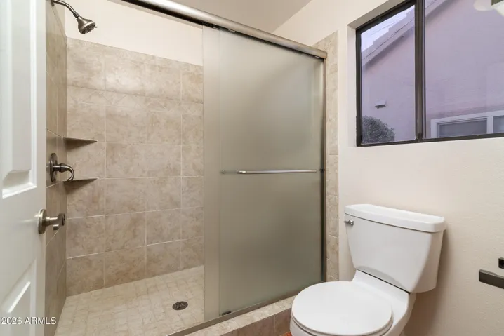 remodeled step-in shower in primary bath