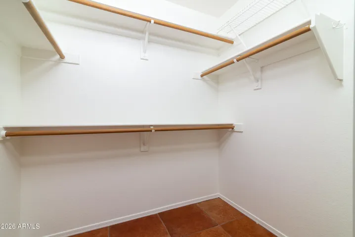 Primary bedroom walk-in closet c