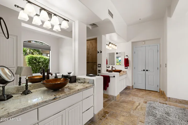 2 Vanities with vessel sinks.