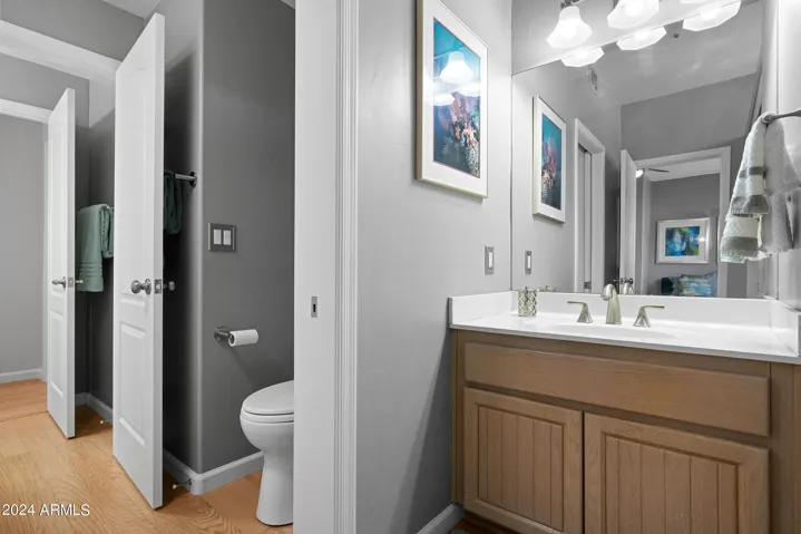 Shared bath with 2 separate vanity areas.