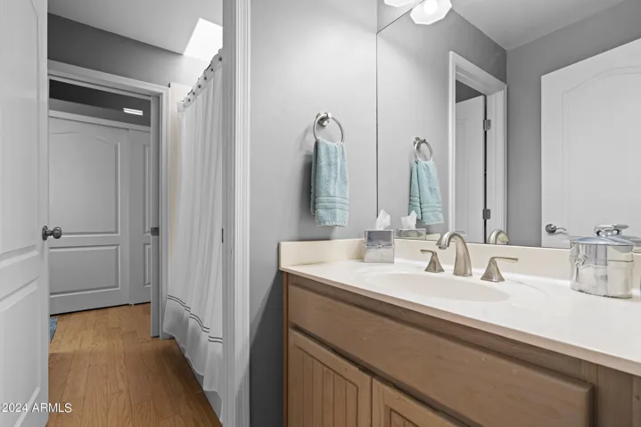 Shared bath with 2 separate vanity areas.