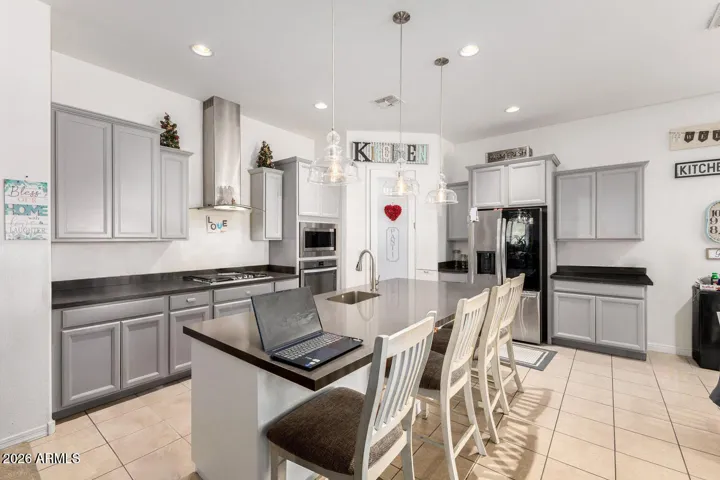 Staggered Kitchen Cabinets and stainless steel appliances
