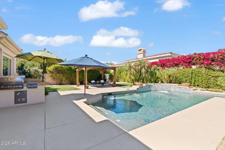 Backyard with built-in grill.