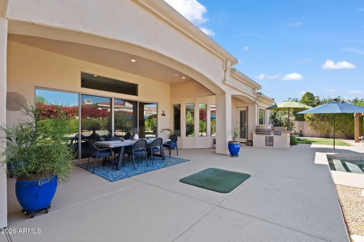 Large slider opens to beautiful covered dining area