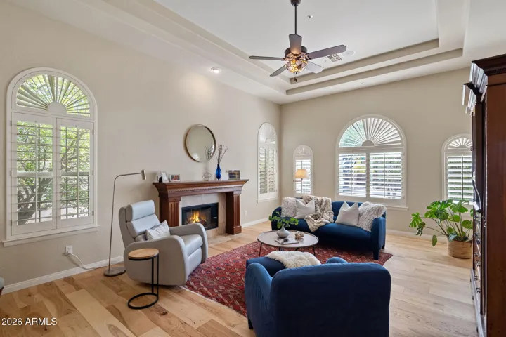 Living Room with Fireplace and plantation shutters