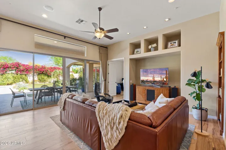 Family room looks into the backyard with beautiful blooms and Citrus trees .
