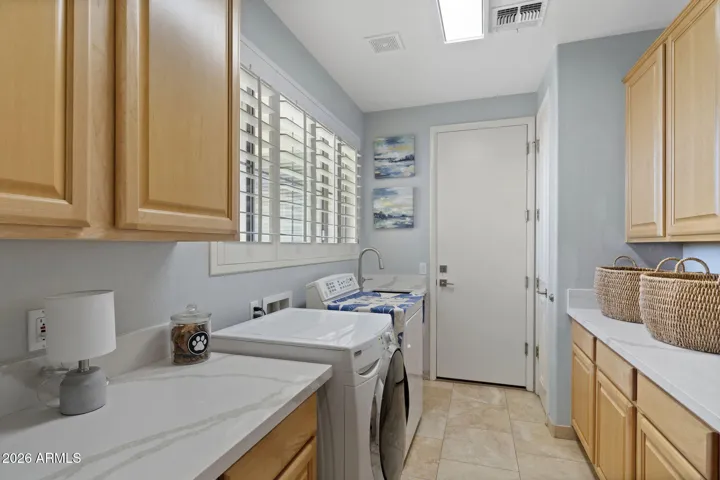 Large Laundry Room with garage entry and New Quartz counters