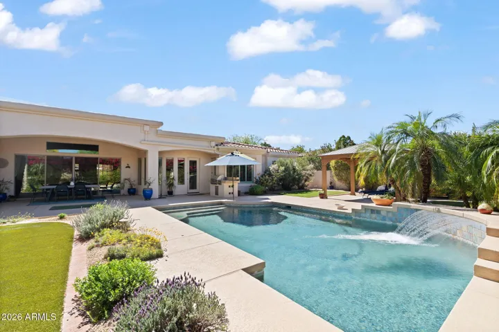 Tranquil yard with pool water feature