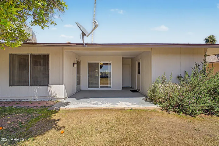 Spacious 1-car garage with built-in storage cabinets and opener, offering practicality and additional storage in this Sun City home.