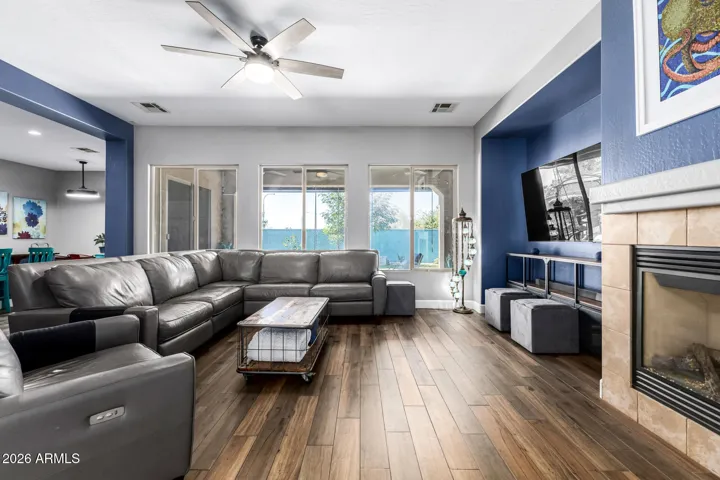 Spacious living room with fireplace perfect to relax with the family.