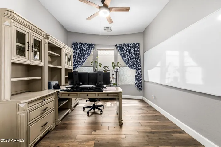 This beautiful den provides added space for a variety of options including formal dining or an office.