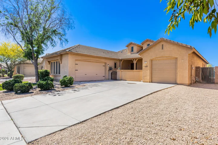 Beautiful front exterior view highlighting both garages.