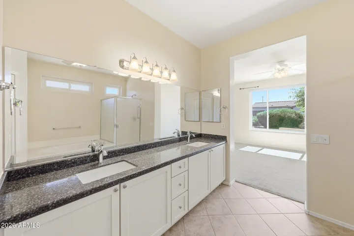 Updated vanity with dual sinks and Quartz countertops.