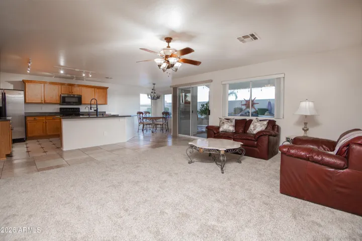 Great room with kitchen and backyard