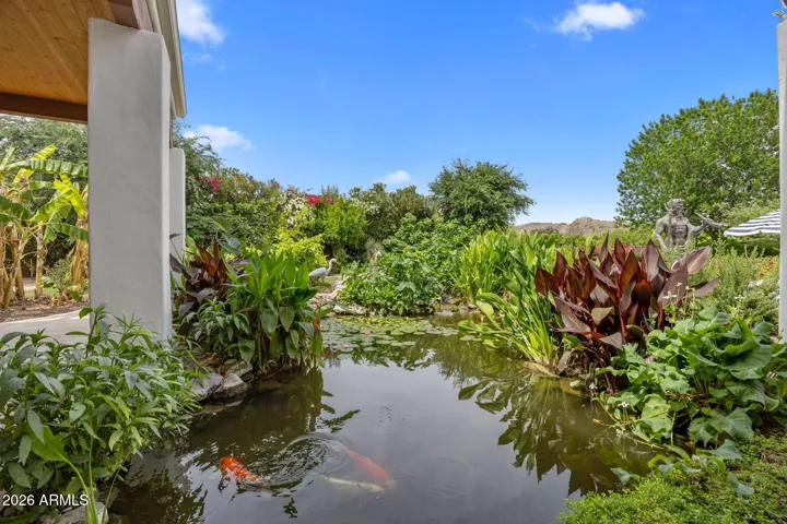 Gorgeous, mature koi pond adds uncommon touch to this special property.