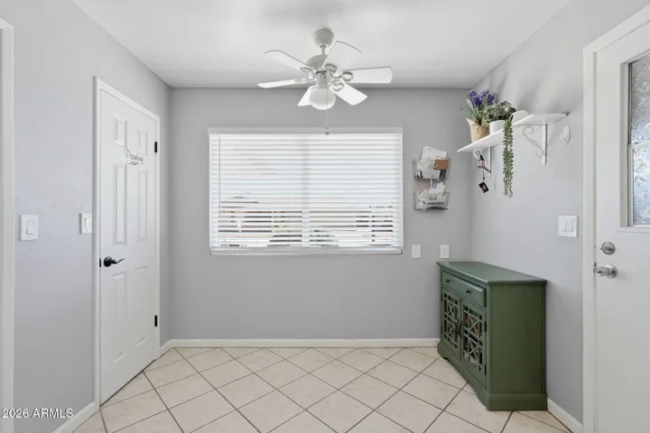 Breakfast nook with lots of natural light and pantry.