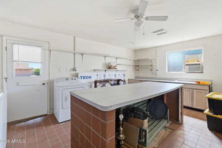 Laundry room conveniently leads to garage.