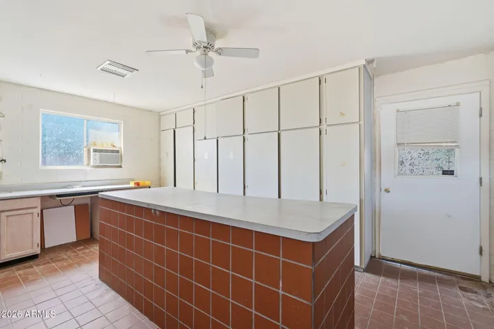 Laundry room with work bench.