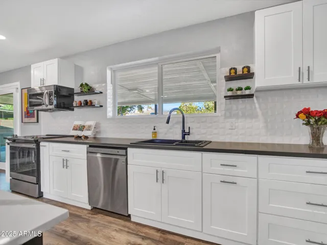 Ample white shaker "soft close" cabinetry for plenty of storage