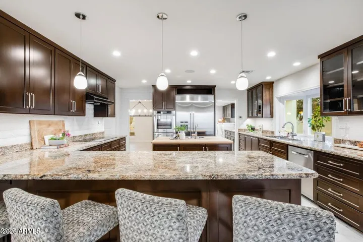 Oh wow! A designer's kitchen, set up for entertaining. Prep space, 3 sinks, wine fridge, etc.