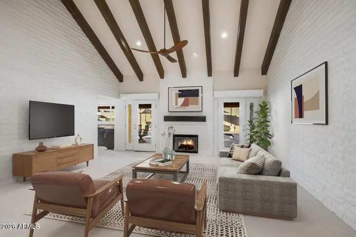 Living room with vaulted ceilings and fireplace. How nice!