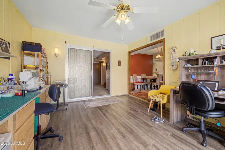 The Family/Craft Room is approximately 12'x 15' with a fan & newer laminate flooring.