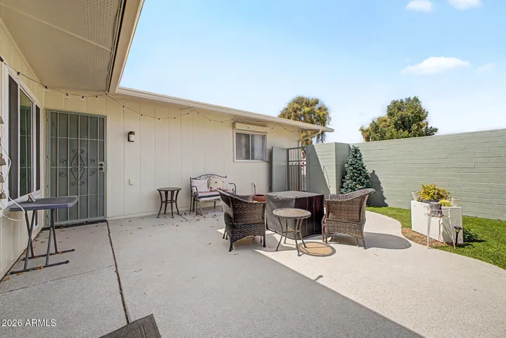 The property has 3 security screen doors...garage to patio door, patio to alley and front door entry.
