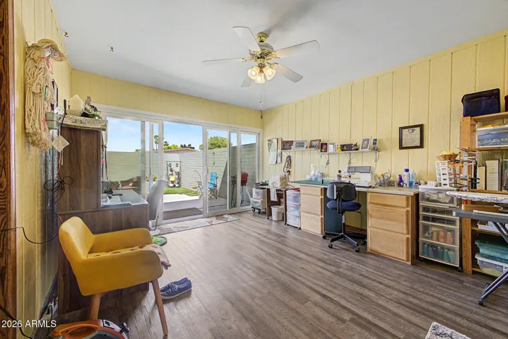 Huge Family Room/Craft Room with newer laminate wood look flooring. Slider to patio just installed in 2024 for easy access