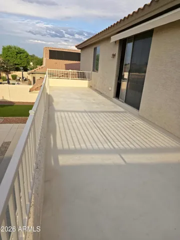 Extended patio 2nd floor sun deck. Slider door to office.