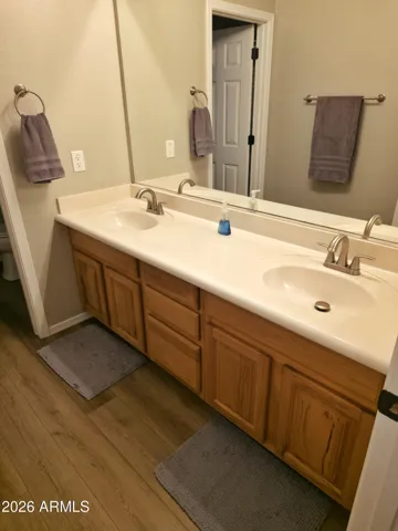 Double vanity with separate toilet and shower room