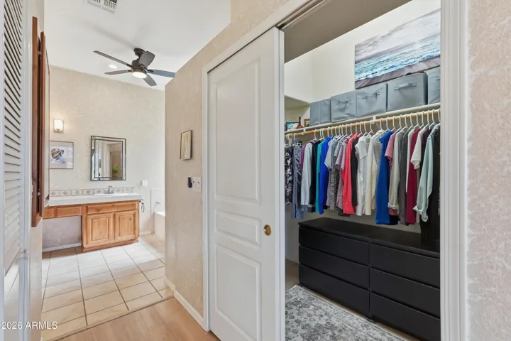 Primary Bedroom Walk-In Closet & Entrance to Bathroom