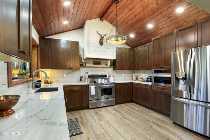 New Kitchen with Quartzite Stone Counters, Walnut Cabinets