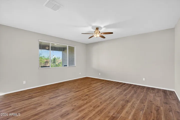 Ceiling fans and blinds throughout the home.