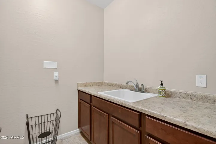 Great storage & sink in the laundry room.