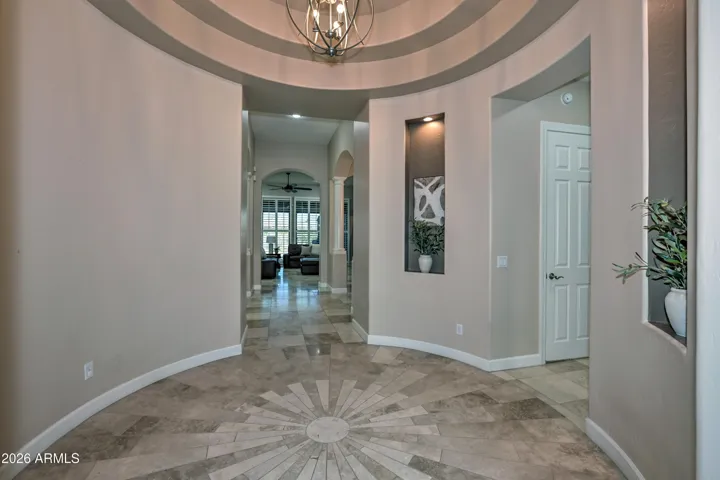 This highly upgraded foyer is so inviting with this custom made medallian.