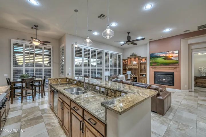 This is the perfect place to unwind after a busy day. With 12 foot soaring ceilings, stunning views, a gas fire place, plantation shutters throughout and so much more!