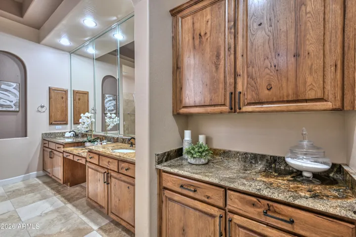 This space has been beautifully upgraded with Knotty Alderwood cabinets and stunning granite.