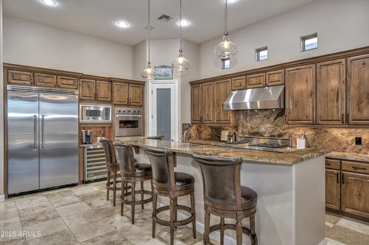 The Knotty Alderwood cabinets and Viking Pro Appliances are just a few of the many upgrades in this home.