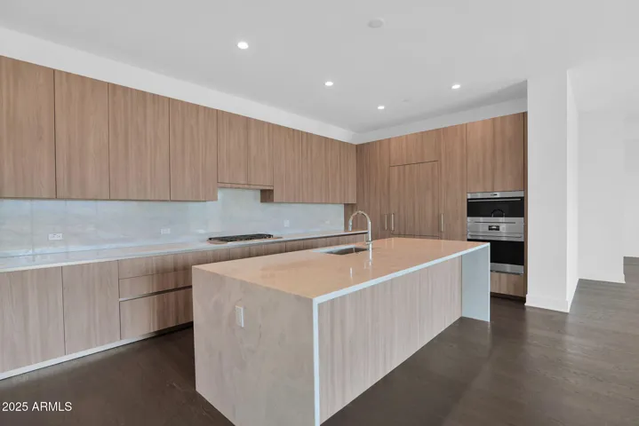 Italian cabinetry with extended 47" uppers and an expansive waterfall island.